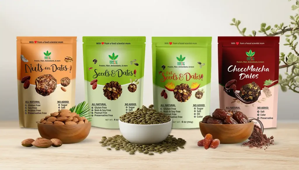 seeds and dates products from simply vegan inc laid out behind small bowls of almonds, pumpkin seeds and dates.